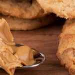 Heart healthy peanut butter cookies with oats and dark chocolate chips on a wooden plate