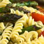 heart healthy plate of pasta with asparagus and tomatoes