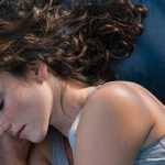 a woman sleeping in bed