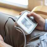 man checking blood pressure