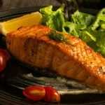 miso maple salmon on a black plate.