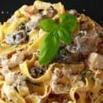 Heart healthy creamy pasta dish on black plate