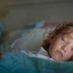 little boy fast asleep