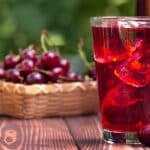 Teart cherry juice on wooden table for insomnia