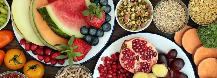 Natural food sources of CoQ10 heart health including salmon nuts and fresh vegetables
