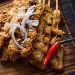 a plate of food on a wooden board