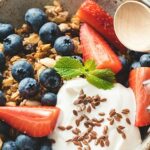 Plain yogurt blood pressure support — live culture yogurt with berries on a wooden board