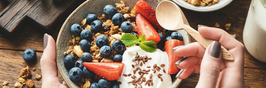 Plain yogurt blood pressure support — live culture yogurt with berries on a wooden board