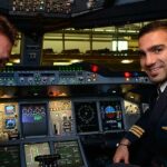 Commercial pilot in cockpit managing hypertension and blood pressure health