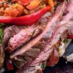 Sliced flan steak on cutting board